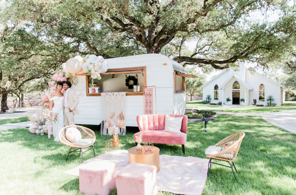 Outdoor lawn space between the ceremony and reception space.
