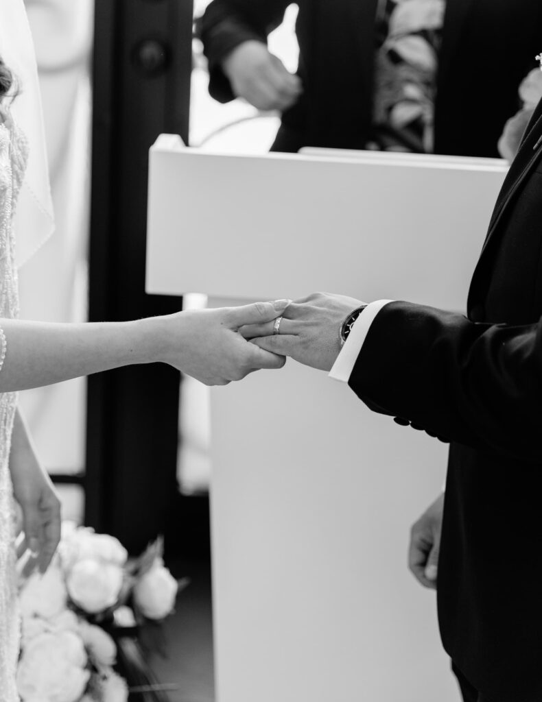 The bride and groom exchanging rings at Little Vegas Chapel wedding venue