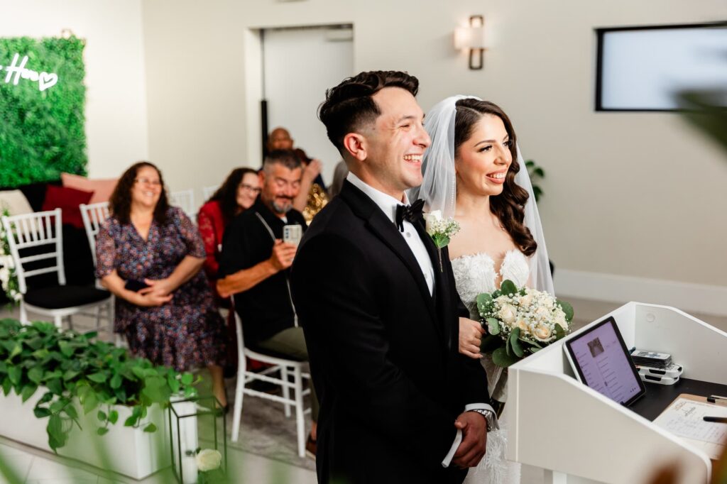 Bride and groom laughing during their ceremony in Vegas at Little Vegas Chapel